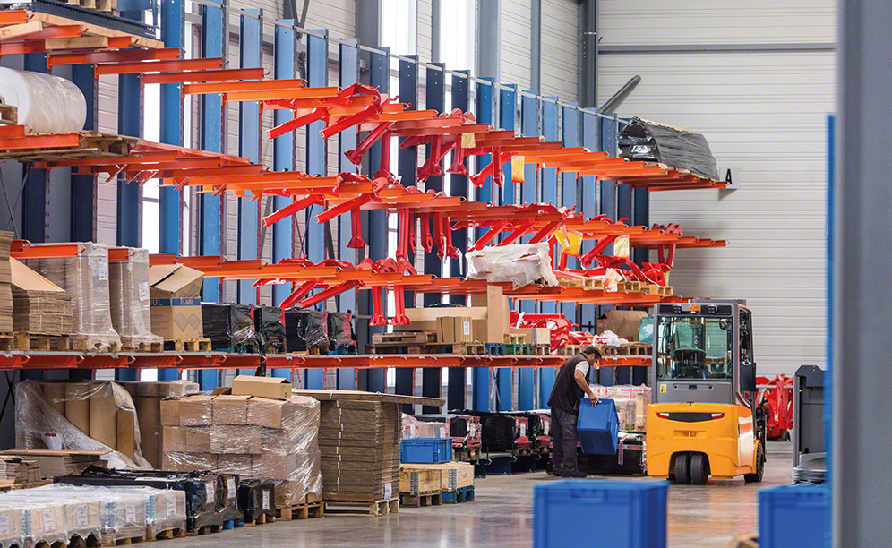 The cantilever racks are 16' high and comprise columns and cantilevered arms on which lengthy or over-sized unit loads are set